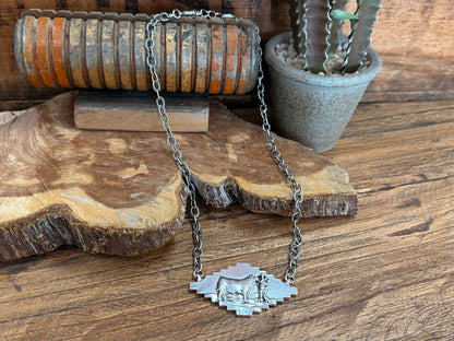 Silver cattle pendant necklace with engraved cow centerpiece and link chain