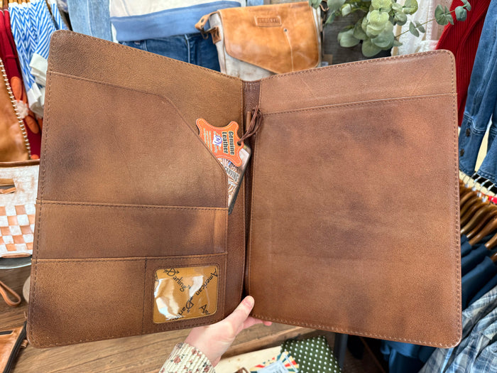 Leather folio notebook interior with two pages, card slots, and pen holder