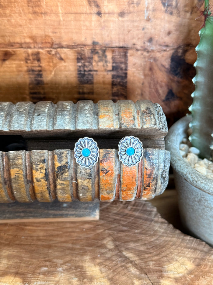 Silver concho stud earrings with turquoise center disks, flower-like bezel