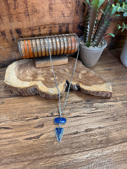 Silver-plated lariat necklace with blue rectangular and teardrop lapis charms