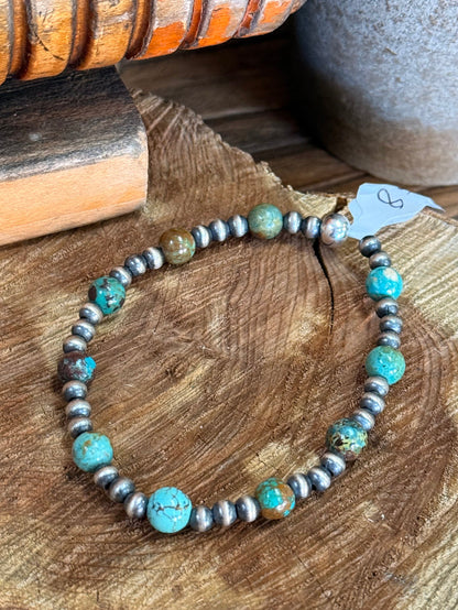 Turquoise bead stretchy bracelet with silver-tone beads and large turquoise centerpiece