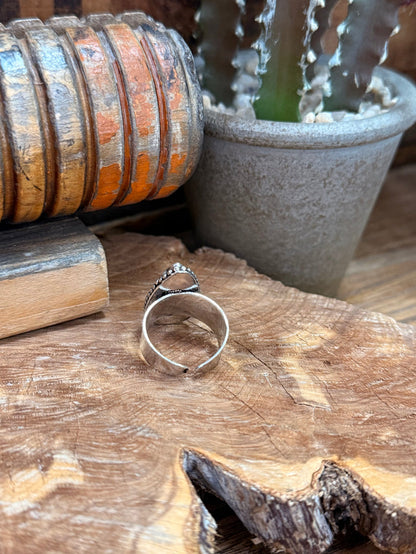 Adjustable silver-tone ring band with blue-gray teardrop stone