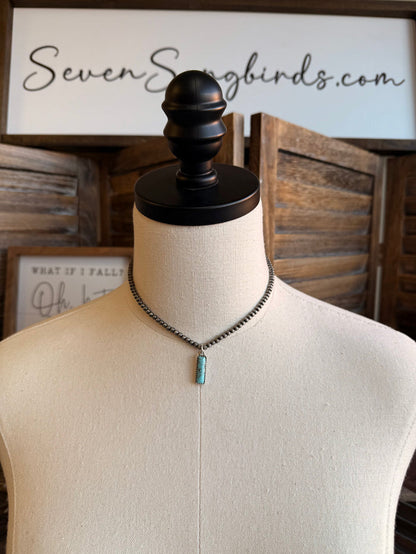 Silver-tone chain necklace with small turquoise rectangular pendant