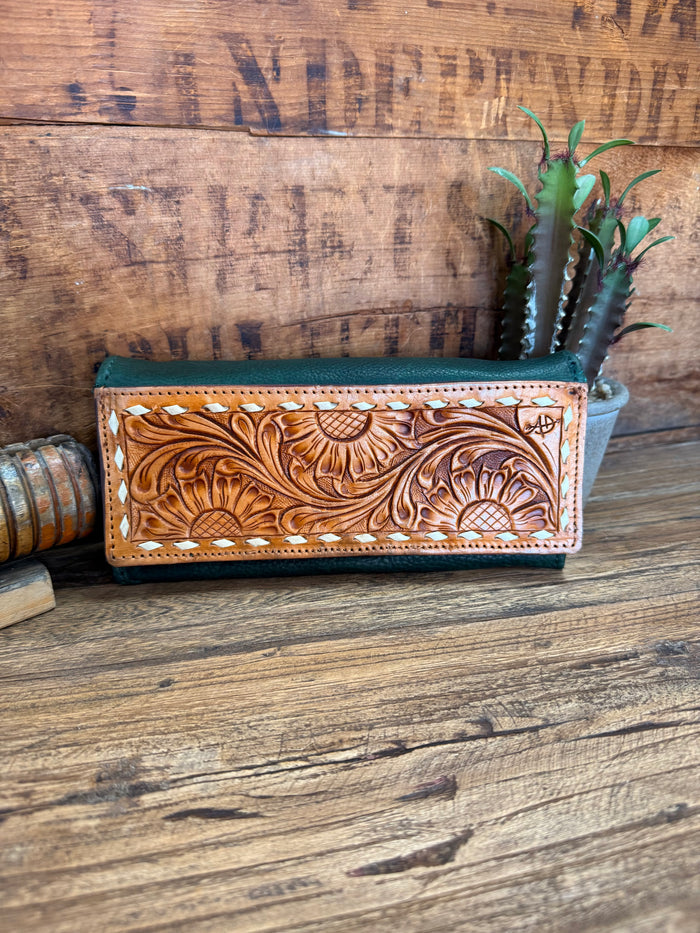 Green leather wallet with hand-tooled brown floral front panel and stitched trim