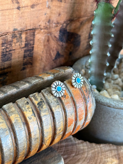 Silver-tone turquoise concho stud earrings, close-up of round rosette centers