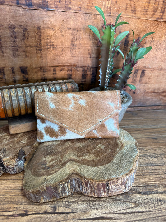 Hair-on envelope coin card wallet with brown and white hide pattern.