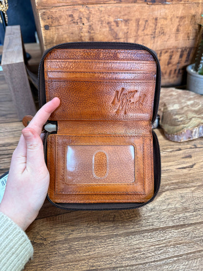 Brown cowhide zip coin wallet, opened view with logo panel and coin compartment