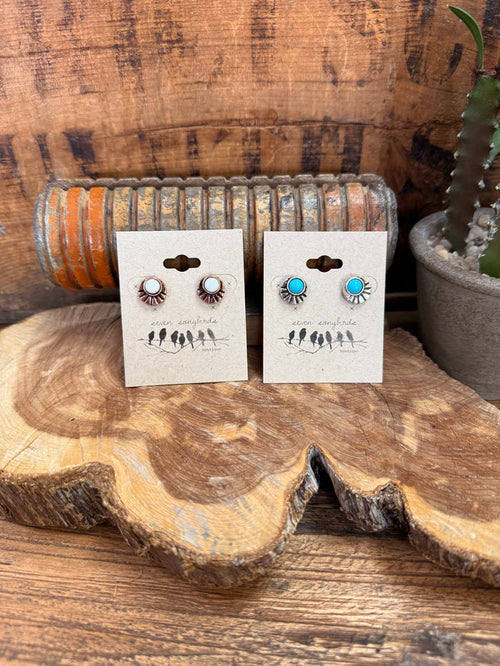 Two pairs stud earrings: copper fan concho with white stone, and silver fan with turquoise