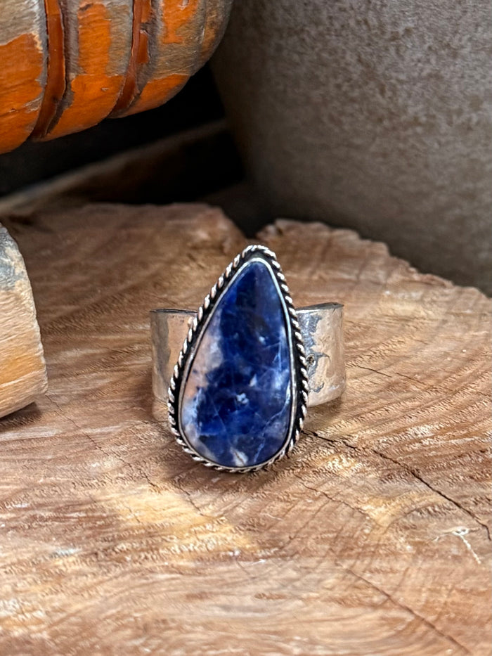 Adjustable silver-plated brass ring with blue sodalite teardrop stone bezel