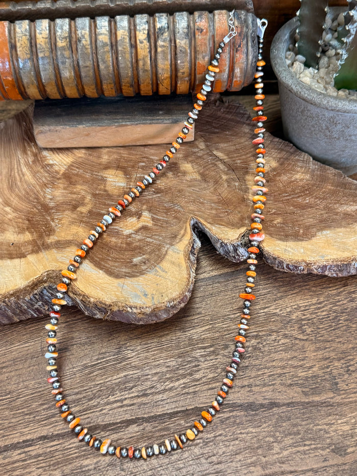 21-inch orange spiny oyster chip necklace with sterling silver beads, full length