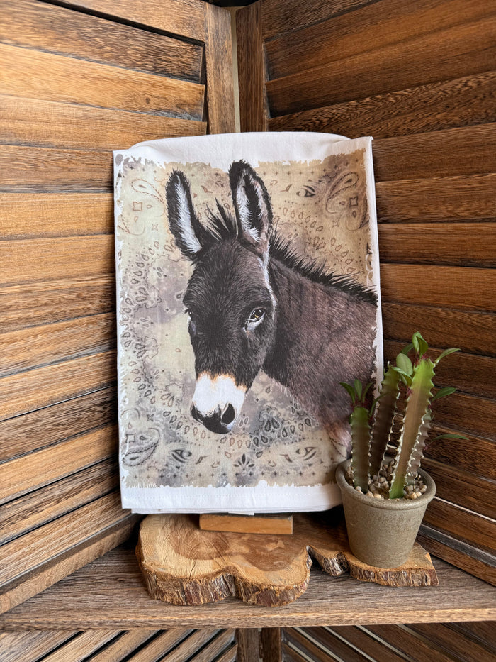 Donkey watercolor tea towel with folded white border and gray-brown donkey portrait
