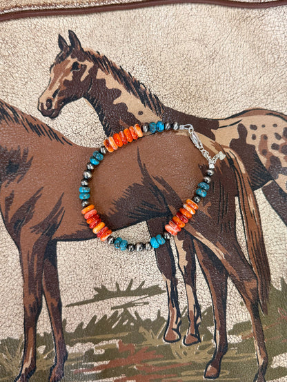 Chunky beaded bracelet with orange and turquoise beads, silver clasp