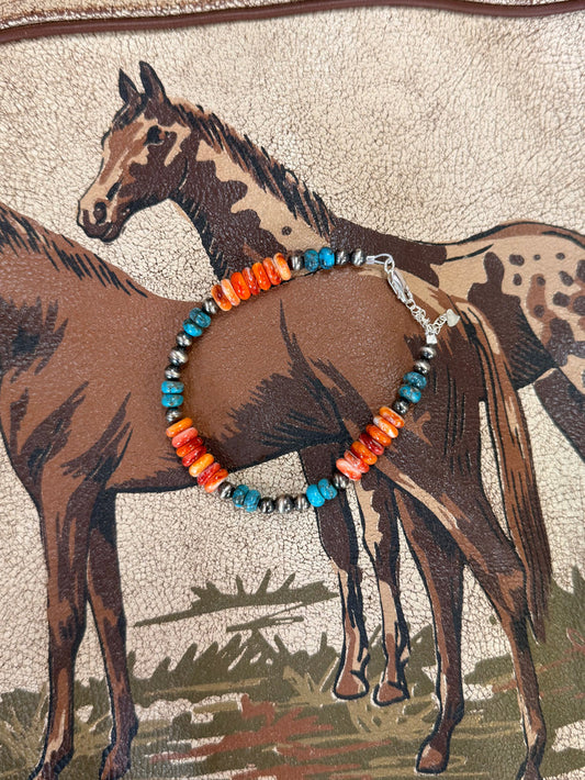 Chunky beaded bracelet with orange and turquoise beads, silver clasp