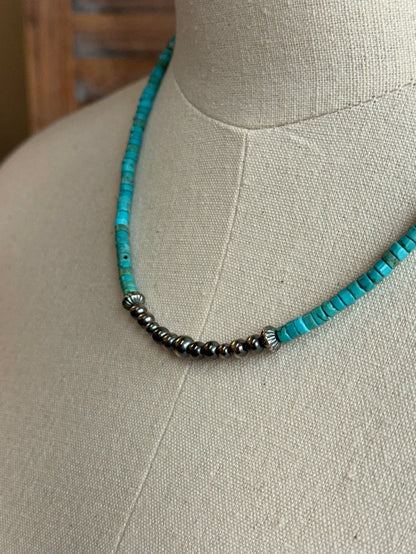 Close-up: blue turquoise heishi beads with sterling pearls on a silver chain