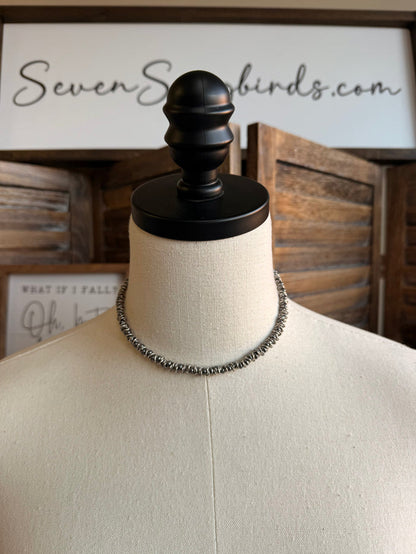 Silver pearl mixed bead necklace with one visible beaded row on mannequin