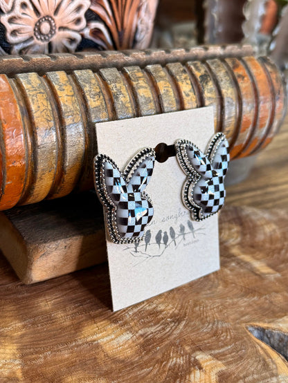 Black and white checkered rabbit stud earrings with metal post, shown on card