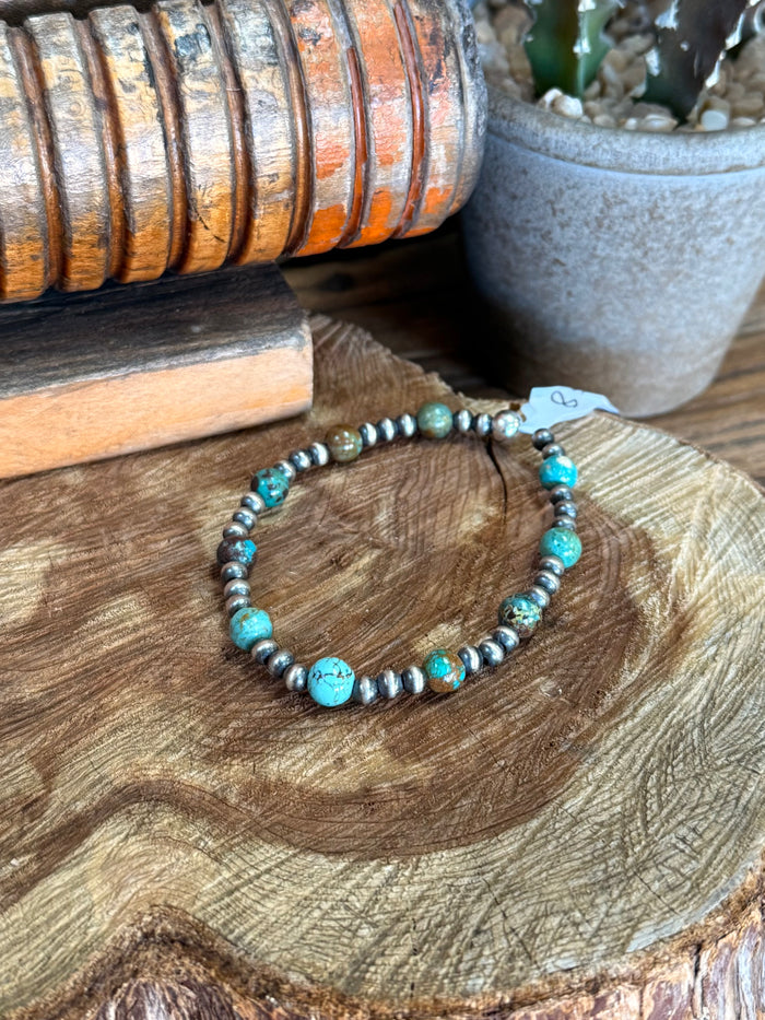 Turquoise bead stretchy bracelet with silver-tone round spacer beads