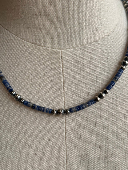 Close-up of blue sodalite heishi beads with silver spacers and round pearls