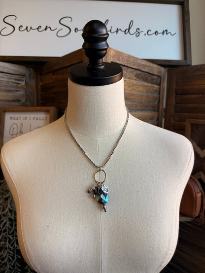 Silver chain necklace with blue crystal cross pendant