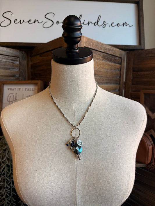 Silver chain necklace with blue crystal cross pendant