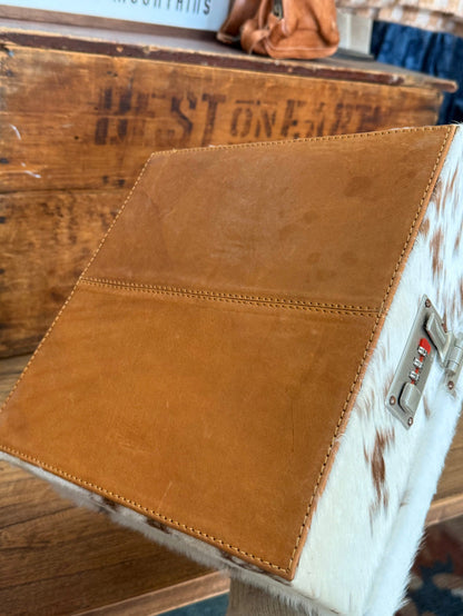 Tooled tan leather jewelry box side panel with hair-on cowhide trim and latch hardware