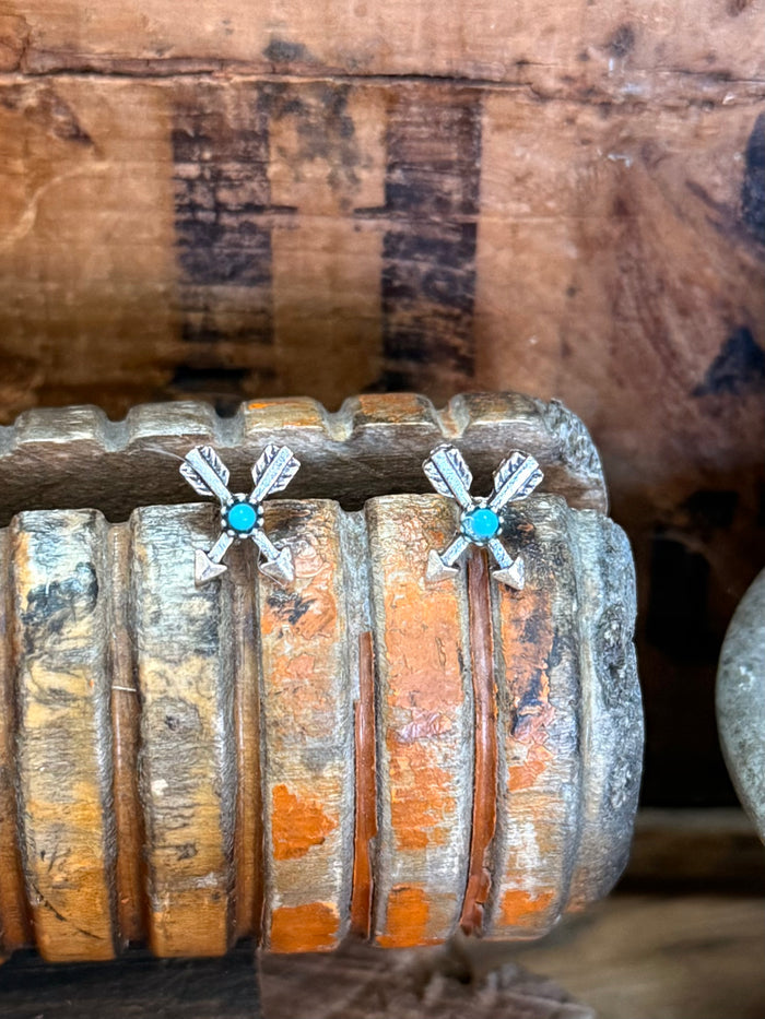 Silver arrow stud earrings with turquoise cabochon stones