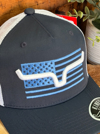 Kimes Capital navy cap close-up with American flag bull graphic and stitched stars