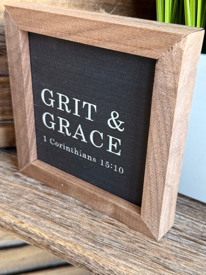 4x4 framed artwork in angled view, wood frame around dark slate with verse text