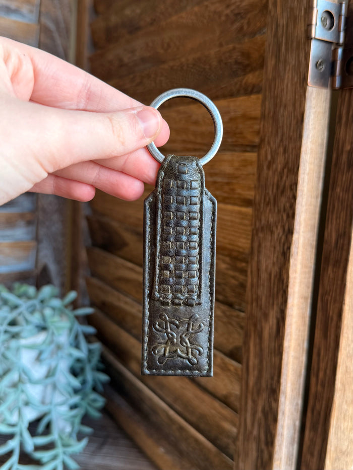 Olive braided leather keychain with metal ring, embossed front with scroll detail