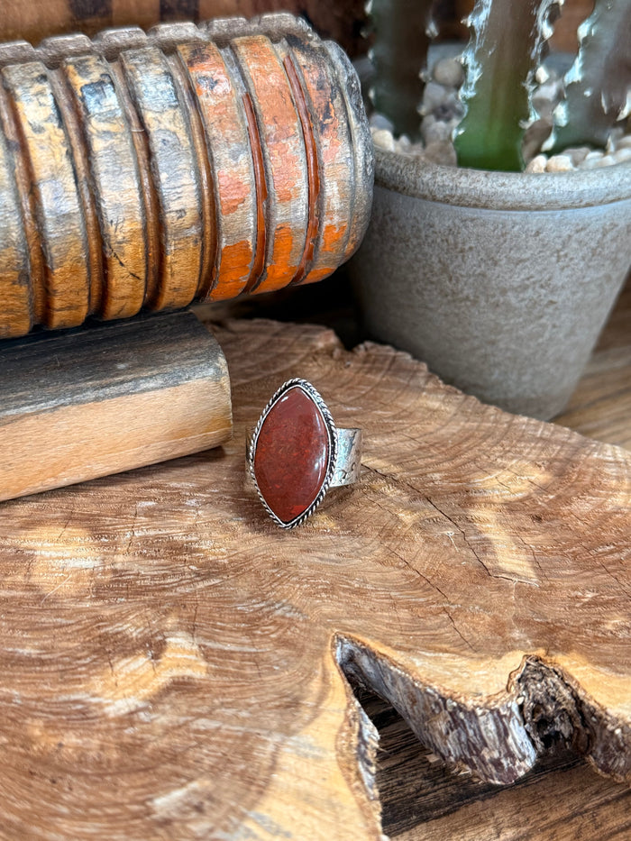 Adjustable silver-tone ring with oval red natural stone centerpiece, rope border
