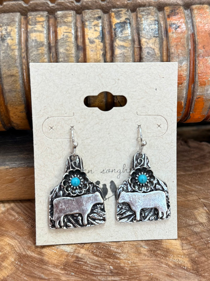 Engraved silver cow tag earrings with turquoise round bead tops, fishhook backs