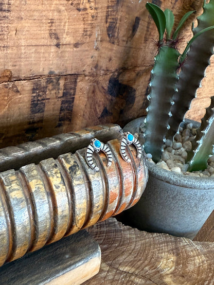 Silver naja stud earrings with turquoise round stones, shown from front and side