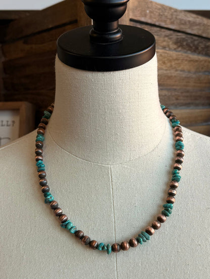 Turquoise and copper bead necklace, continuous strand of round beads on mannequin