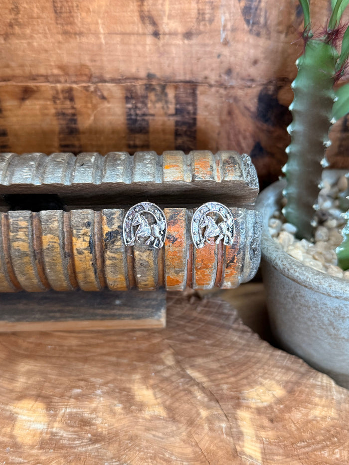 Silver-tone horse and horseshoe stud earrings, small round beaded border.