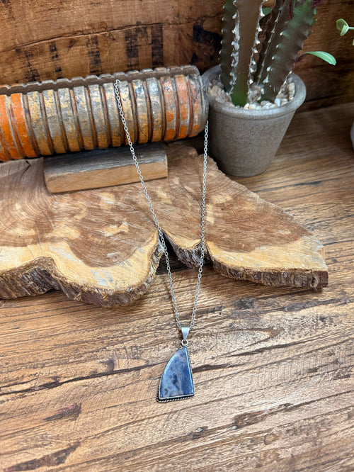 Silver chain necklace with blue triangular stone pendant