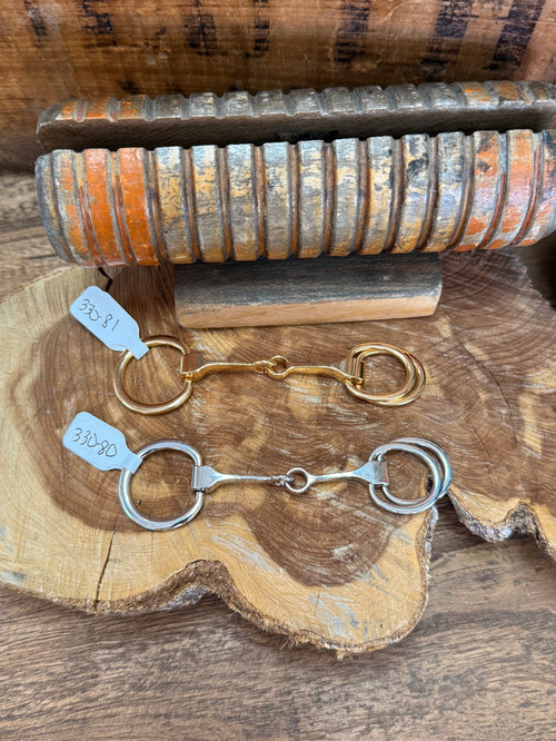 Metal scarf slide with snaffle bit and linked rings, silver and gold finish