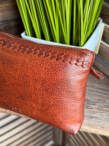 Rusty brown mini wristlet bag with top zip and braided leather detail
