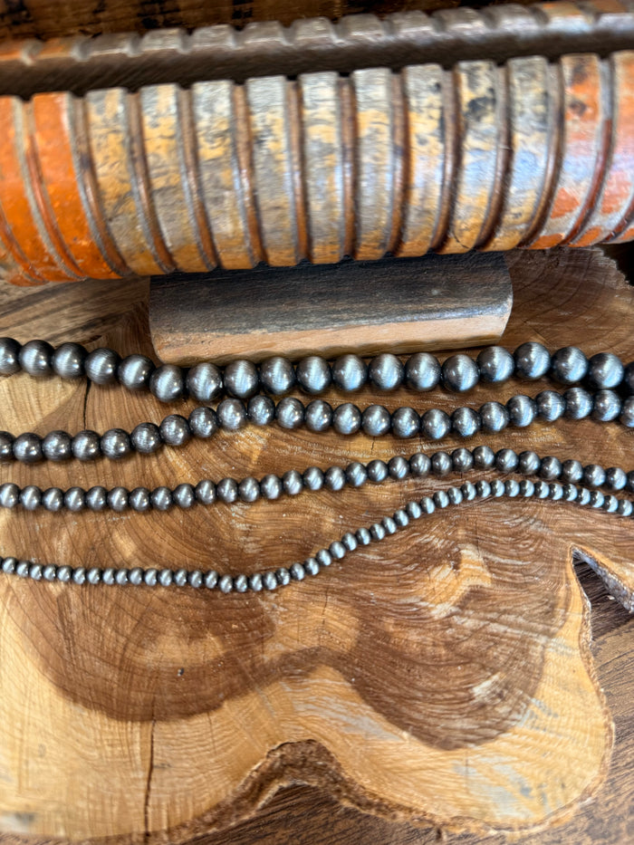 16-inch silver pearl bead necklace, single strand with small round pearls.
