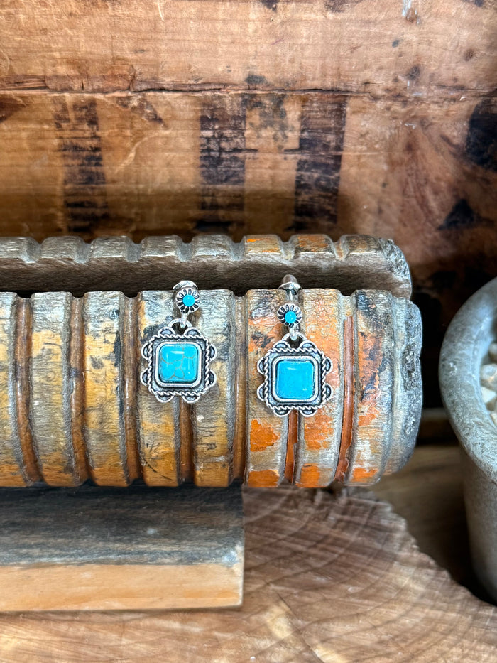 Silver and turquoise square dangle stud earrings with blue top bead and ornate frame
