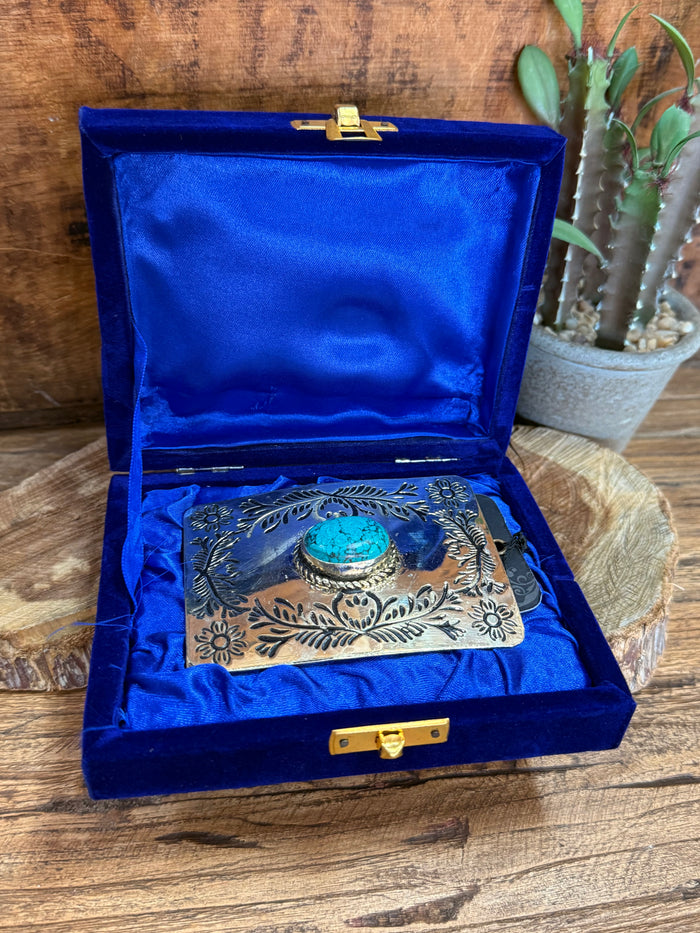 Turquoise stone belt buckle presented in a blue gift box with satin lining