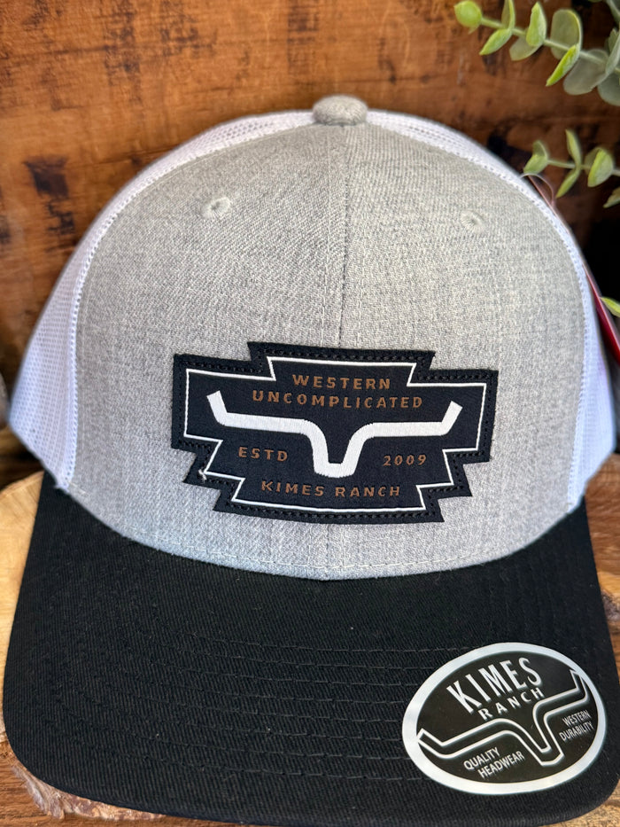 Grey heather trucker hat with Western Uncomplicated banner and black brim