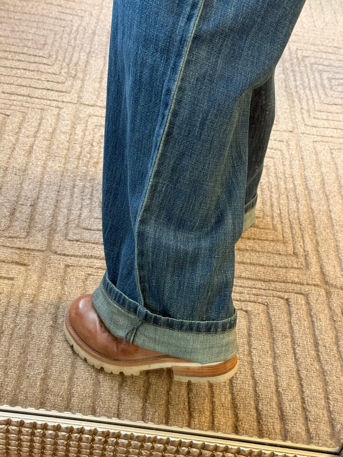 Maggie jeans hem detail in antique wash denim, cuffed with brown boot