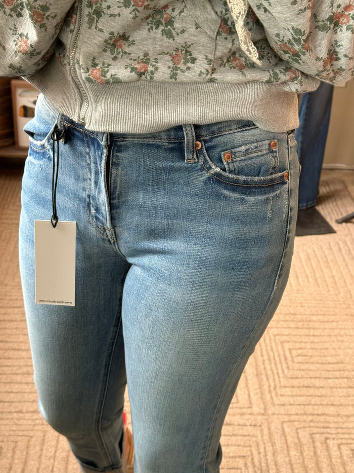 Light blue straight-crop jeans with cuffed hem, coin pocket, and side stitching