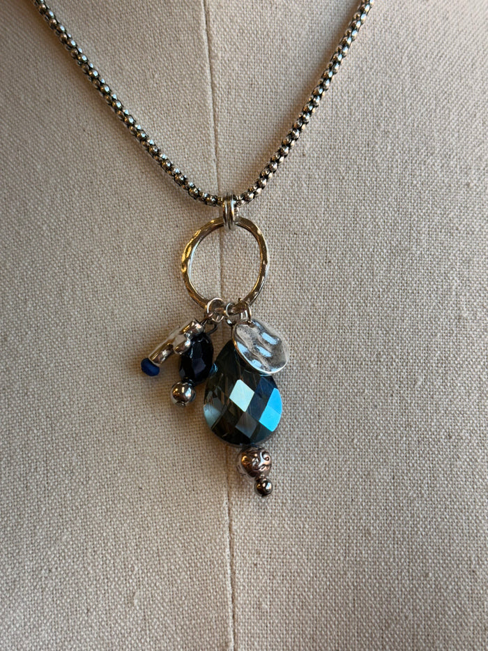 Blue crystal cross pendant with hoop link on silver chain