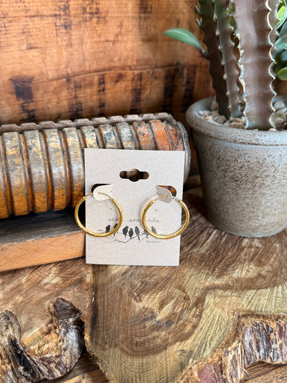 Silpada gold-tone hoop earrings with textured round hoops, shown on retail card