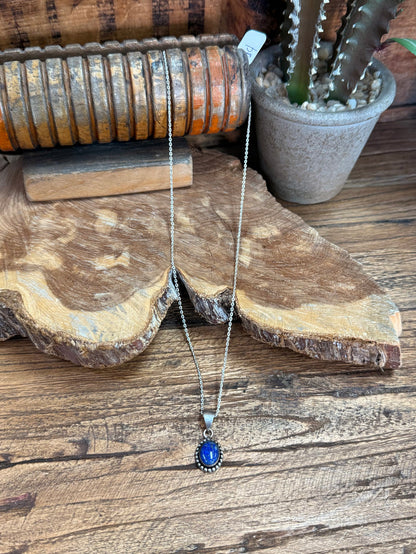 Lapis blue pendant necklace with silver chain and round bezel frame