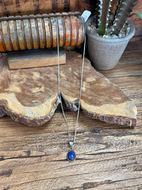 Lapis blue pendant necklace with silver chain and round bezel frame