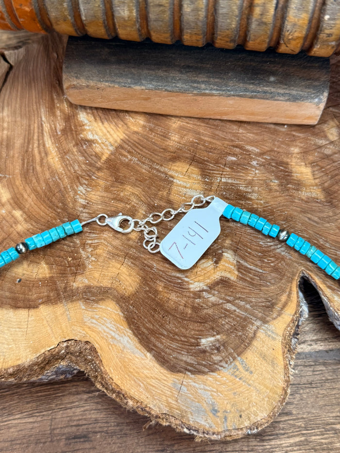 Turquoise heishi bead necklace clasp with silver chain and small tag