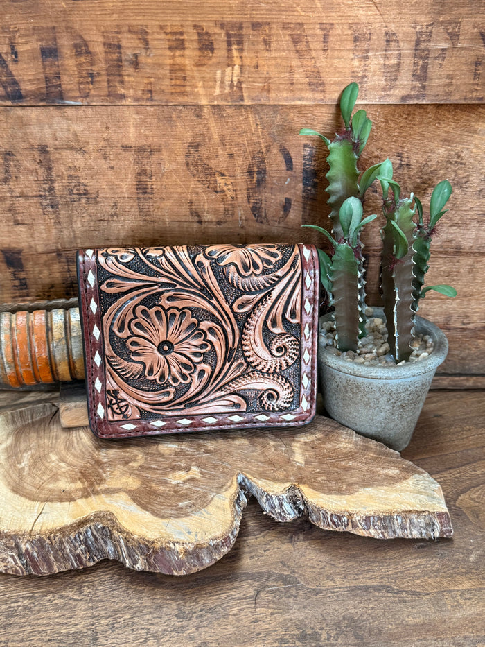 Tooled cowhide bifold wallet with floral embossing and stitched edges, dark brown