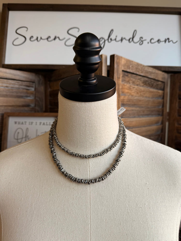 Silver pearl mixed bead necklace with double-row beaded choker on mannequin